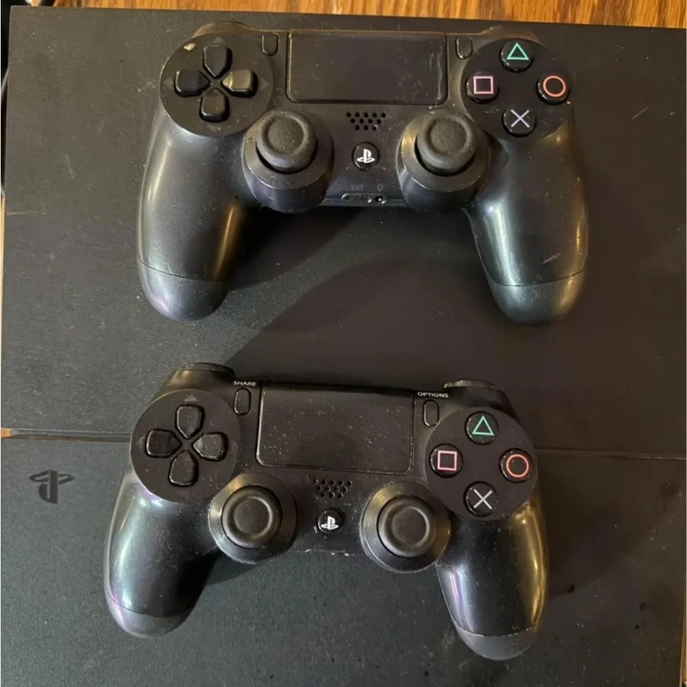 PlayStation 4 with two controllers and Dragonball Z Kakorat